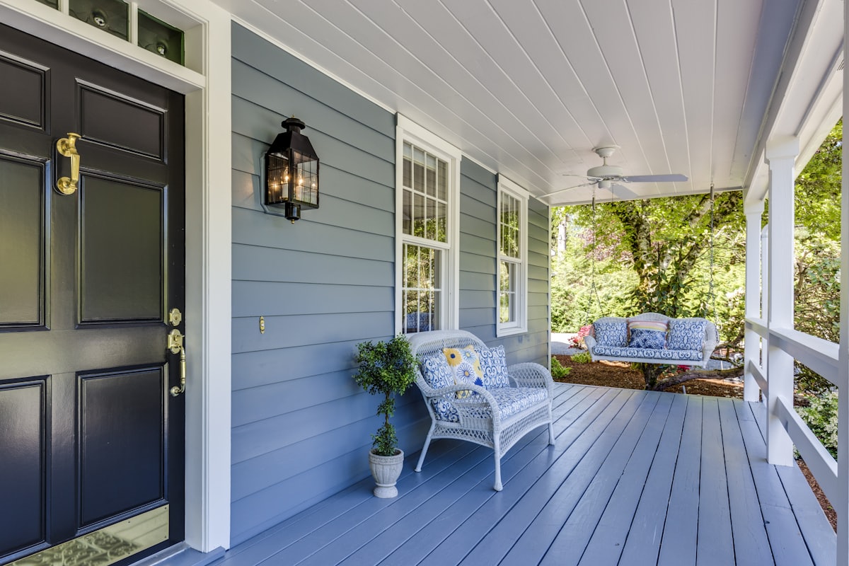 Painted porch with a dark front door