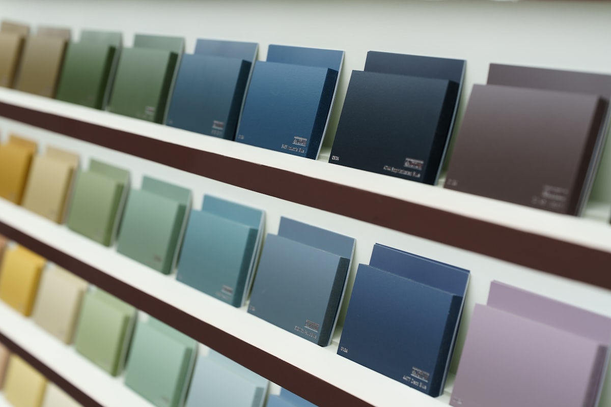Paint colour chips fanned out on a shelf